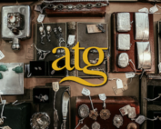 Antiques flat-lay with ATG company logo