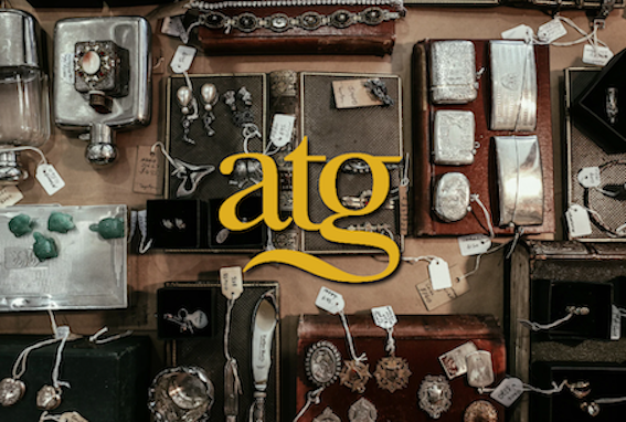 Antiques flat-lay with ATG company logo